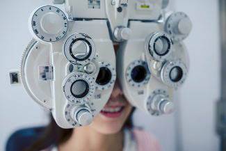Optometrist, Girl receiving eye exam in Burnsville, Minnesota